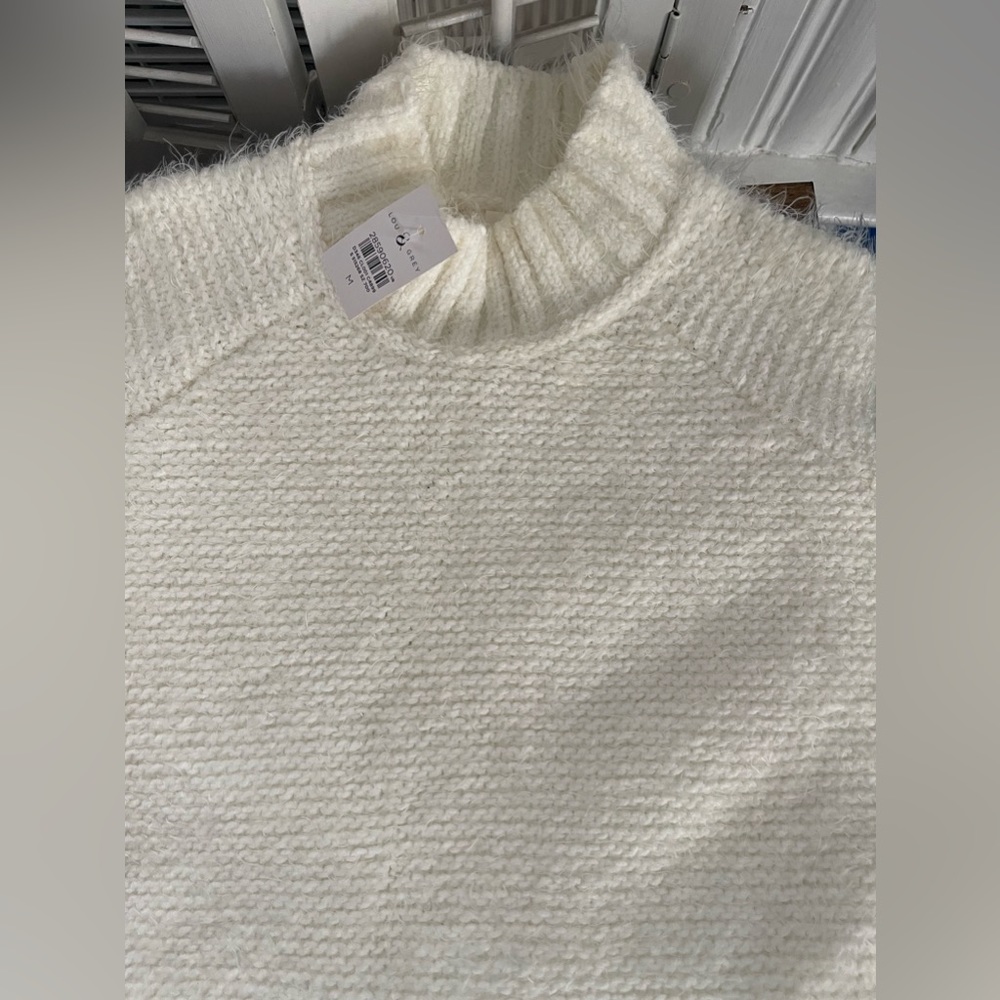 Soft white turtleneck sweater